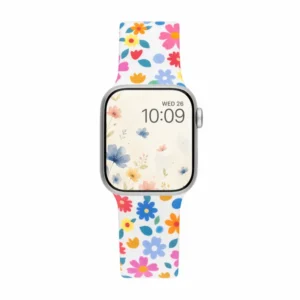 White silicone Apple Watch band with colorful pink blue and yellow retro flower pattern.