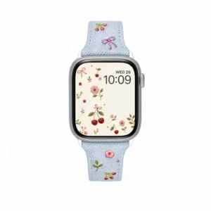 Light blue denim style vegan leather apple watch strap for women with embroidered cherries and pink bows.