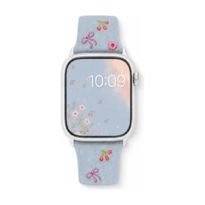 Light blue denim style vegan leather apple watch strap for women with embroidered cherries and pink bows.