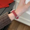 Red Vegan PU Leather Apple Watch Strap with white stitching and slim tapered design.