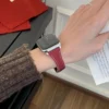 Red Vegan PU Leather Apple Watch Strap with white stitching and slim tapered design.