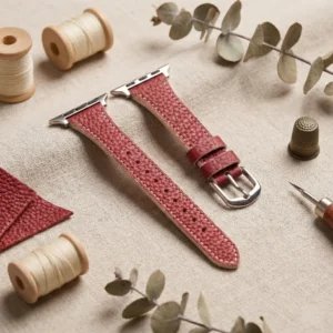 Red Vegan PU Leather Apple Watch Strap with white stitching and slim tapered design.