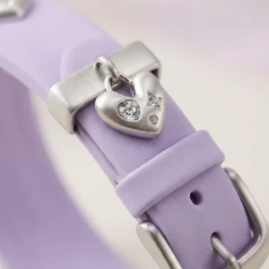 Lilac purple leather Apple Watch band for women with a silver metal heart charm.