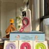 Rose Magenta foldable MagSafe stand for iPhone, adjustable multi-angle magnetic phone holder for desk and video calls.
