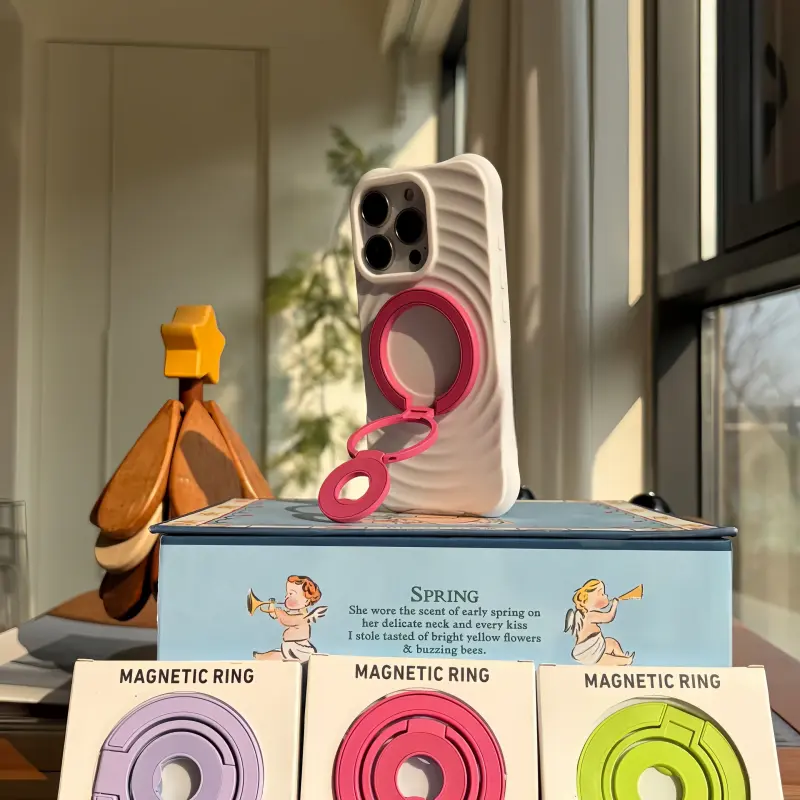 Rose Magenta foldable MagSafe stand for iPhone, adjustable multi-angle magnetic phone holder for desk and video calls.