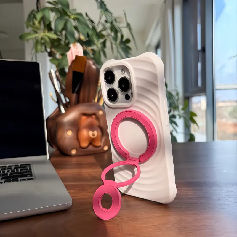 Rose Magenta foldable MagSafe stand for iPhone, adjustable multi-angle magnetic phone holder for desk and video calls.