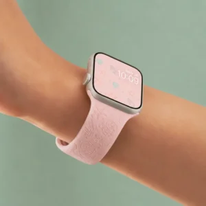 Blush Coral Silicone Apple Watch Strap for women featuring soft pastel pink engraved starfish and seashell patterns.