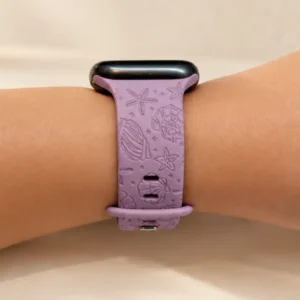 Lilac Coral Silicone Apple Watch Strap for women featuring soft pastel purple engraved starfish and seashell patterns.