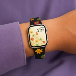 Retro Poppy silicone Apple Watch band with colorful abstract flowers on a black background, comfortable strap for women.