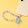 Durable pastel daisy blue beaded phone strap for women featuring a lightweight acrylic bead chain and a silver metal clasp.