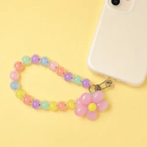 Durable pastel daisy pink beaded phone strap for women featuring a lightweight acrylic bead chain and a silver metal clasp.