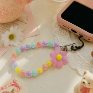 Durable pastel daisy pink beaded phone strap for women featuring a lightweight acrylic bead chain and a silver metal clasp.