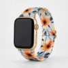 Comfortable braided loop Apple Watch band for women featuring a vintage peach floral pattern on a stretchy replacement strap.