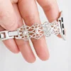 Moonbeam ivory pearl lace stainless steel Apple Watch band for women. Vintage metal replacement wristband with pearl accents.