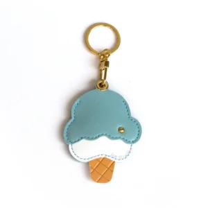 Blueberry ice cream cone vegan leather AirTag case in dusty blue and cream with gold keyring, cute AirTag holder for women