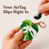 Monstera leaf vegan leather AirTag case in green and white with gold keyring clasp, cute AirTag holder for women
