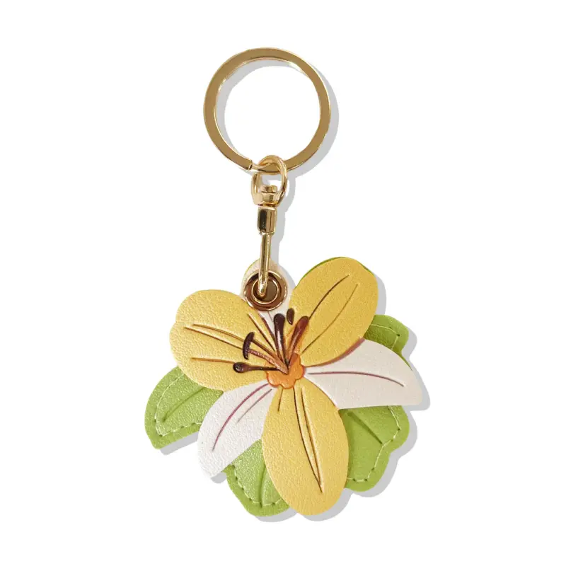 Vegan leather AirTag case in yellow and ivory vintage lily design with gold keyring, cute AirTag holder for women