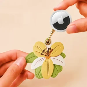 Vegan leather AirTag case in yellow and ivory vintage lily design with gold keyring, cute AirTag holder for women