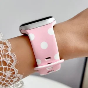 Baby pink Apple Watch band for women with white polka dots, comfortable silicone replacement strap.
