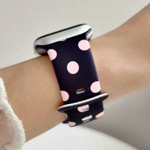 Black Apple Watch band for women with bubblegum pink polka dots, comfortable silicone replacement strap.