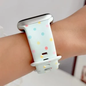 Mint green Apple Watch band for women with pastel rainbow confetti polka dots, soft silicone replacement strap.