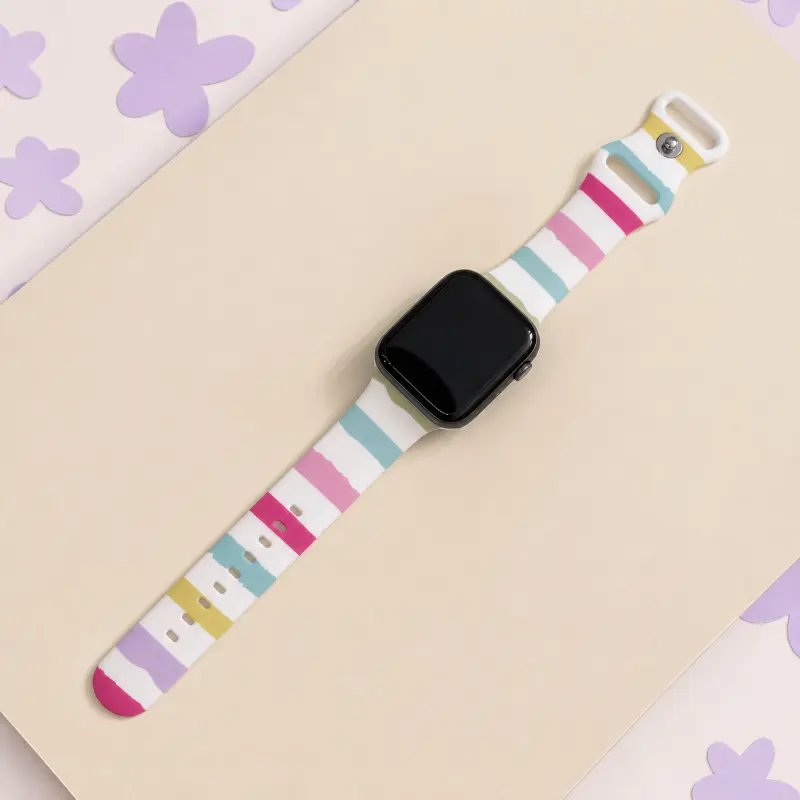 Pastel stripe silicone Apple Watch band replacement for women featuring vintage rainbow paint strokes.