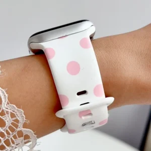 White Apple Watch band for women with bubblegum pink polka dots, comfortable silicone replacement strap.