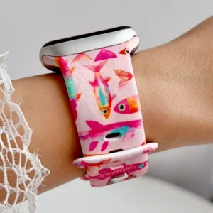 Pink tropical fish Apple Watch band for women, comfortable silicone replacement strap with coral reef print.