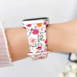 White silicone Apple Watch band for women with a vintage plum anemone, pink, and orange floral pattern. Comfortable replacement wristband.