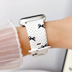 Polka dot and black bow silicone Apple Watch band replacement wristband for women offering comfortable daily wear.