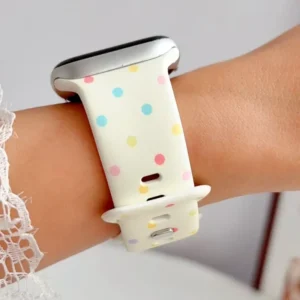 Vanilla cream Apple Watch band for women with pastel rainbow confetti polka dots, soft silicone replacement strap.